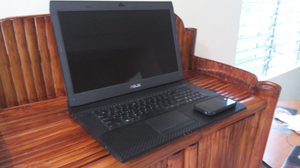 Our broken ASUS with iPhone 4S for scale.  Too big!